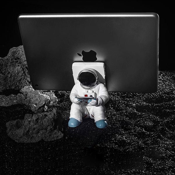 Unterstützung für Mobiltelefon oder Stift in Astronautendekorationen