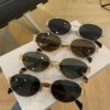 Damen elegante ovale Sonnenbrille mit goldfarbenem Rahmen