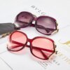 Damen große cat-eye Sonnenbrille mit dekorativen Akzenten