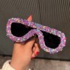 Damen trendige Sonnenbrille mit kreativem Zuckerguss-Design