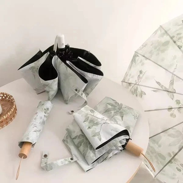 Damen Faltregenschirm mit botanischem Druckdesign