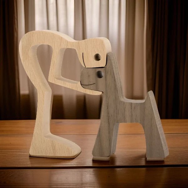 Handgefertigte Holzfigur von Hund und Mensch