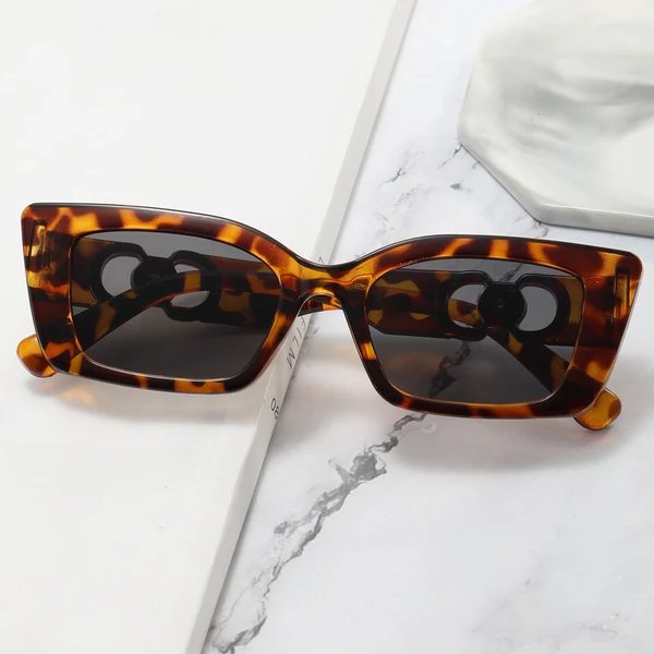 Damen Rechteckige Designer-Sonnenbrille mit luxuriösen Akzenten