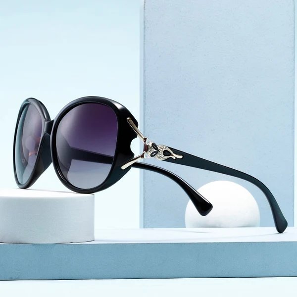 Damen Modische Sonnenbrille im eleganten Design mit auffälligen Verzierungen