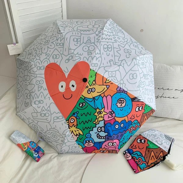 Damen Faltregenschirm mit bunten Comic-Motiven